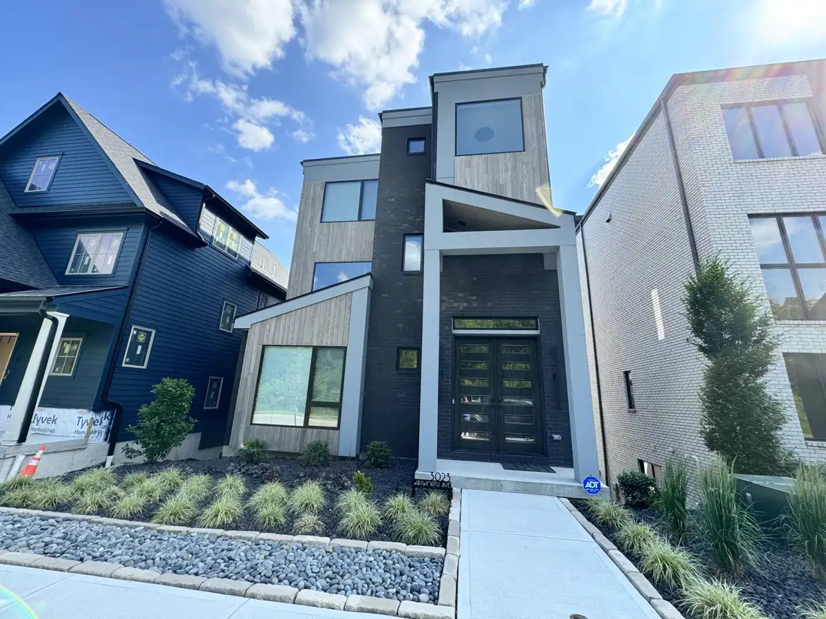 Modern multi-story home with clean exterior siding by Skyline