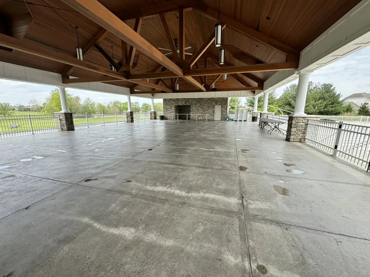 Clean concrete floor under an outdoor pavilion