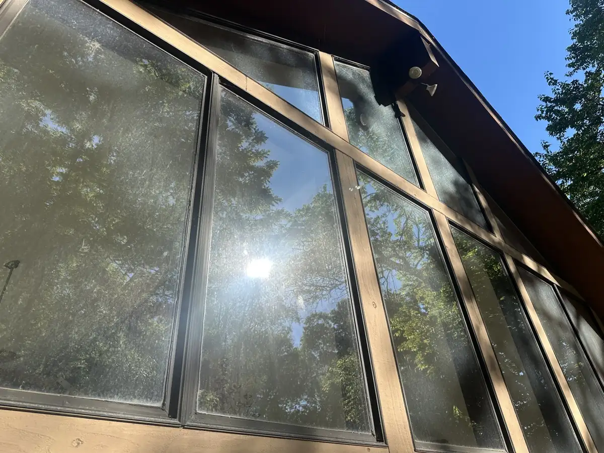 Hazy, water-spotted windows before professional window cleaning by Skyline